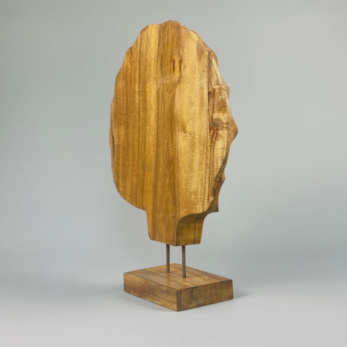 Side view of the shell sculpture highlighting the asymmetry, warm acacia tones, and upright stance. Ideal for display on a sculptural pedestal or open shelving in modern natural homes or contemporary rustic interiors.