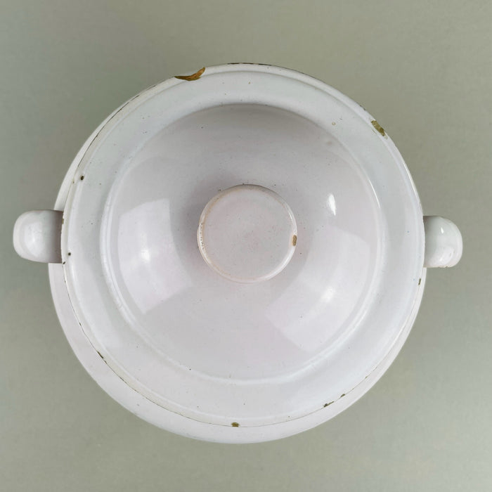 Overhead view of domed ceramic lid with knob handle, belonging to antique French Martres Tolosane confit pot. White glaze with age-related chips confirms authenticity. Early pot à conserve storage jar adaptable as rustic French urn-style decorative object.