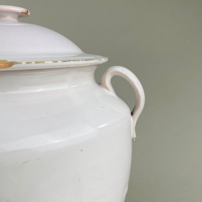 Antique French white ceramic confit pot photographed front view with lid in place. Twin handles and domed top define this Martres Tolosane pot à conserve. Historic French pottery ideal as rustic urn, farmhouse kitchen jar, or provincial display piece.