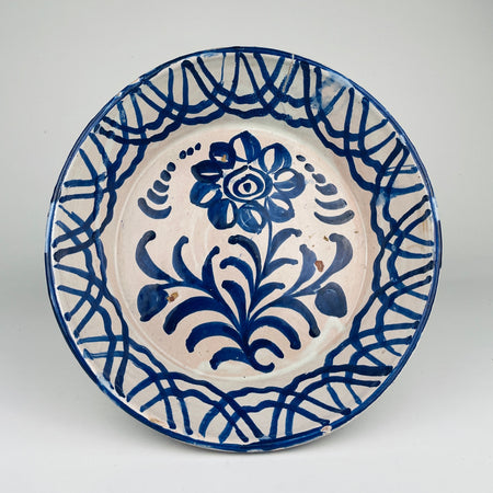 Antique Spanish Fajalauza lebrillo bowl, hand painted in cobalt blue with a central flower and geometric border, showing traditional Andalusian tin glaze from Granada, ideal for Rustic Home Decor, Cottage Decor, Coastal decor, French country decor, Mediterranean Decor, Japandi, and wabi sabi styling in vintage kitchens or farmhouse decor displays.