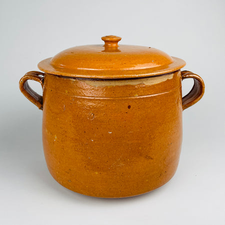 Matching domed lid from a large antique Vallauris marmite, finished in mustard and honey ochre glaze with a circular knob and broad fitted rim. The glazed terracotta cover completes this rare French confit pot and lidded crock by Foucard Jourdan, an evocative example of Provence pottery and antique French cookware.