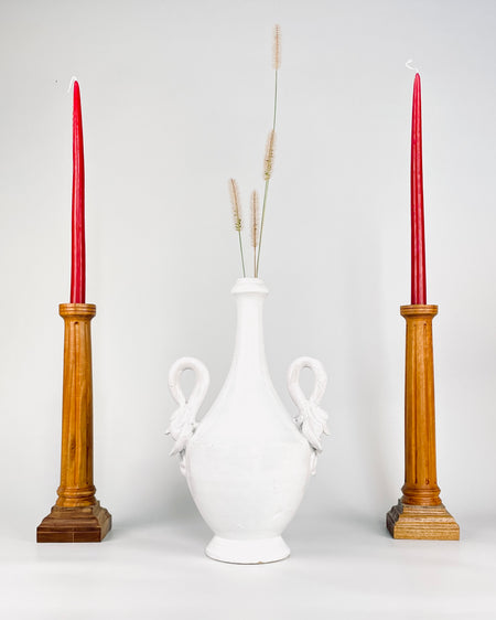 Large white Italian pottery vase with twin swan handles framing an elongated bottle neck above a rounded body and pedestal foot. The restrained  monochrome glaze allows the unusual handles and classical proportions to stand out, making this mid century decorative ceramic compatible with vintage home decor and eclectic decor.
