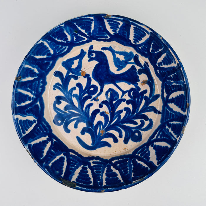Large antique Spanish Fajalauza wall hanging ceramic bowl from 19th-century Granada, hand-painted in cobalt blue on tin-glazed earthenware. The bird and foliate motif is characteristic of Andalusian folk pottery. Designed for wall display yet substantial enough to function as a decorative serving bowl or table centerpiece, this piece complements Rustic Home Decor, Mediterranean Decor, Farmhouse Decor, and French Country Decor interiors.