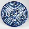 Large Spanish Fajalauza lebrillo bowl in hand painted blue and white earthenware, displayed as a decorative centerpiece with oranges. This Granada pottery bowl has a wide round form, floral center, and radiating wave motifs typical of traditional Fajalauza ceramics. Its scale makes it ideal for Mediterranean decor, Spanish decor, vintage home decor, or a statement fruit bowl on a dining table.