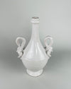 Large Italian ceramic vase in glossy white glaze, with an ovoid footed body and one applied swan ornament fully visible as the bird’s curved neck forms the handle. Dating to circa the 1950s to 1960s, this sculptural vase offers a distinctive vintage focal piece for classical decor or a console display with dried stems.