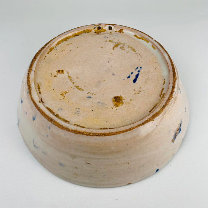 Rim edge detail highlighting hand-thrown irregularities and glaze pooling on an antique Spanish Fajalauza serving bowl, reinforcing its handmade origin. Whether styled as wall hanging ceramic decor or a rustic tabletop object, it enhances Mediterranean Decor and Rustic Home Decor.