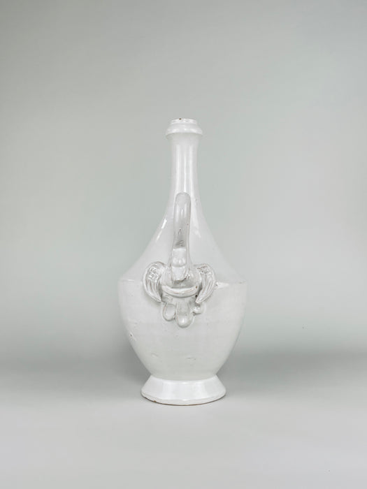 Rolled ceramic mouth of the large Italian vase, finished in a glossy ivory white glaze with small age-related chips and wear along the inner rim. The narrow neck and compact opening reinforce the tall amphora silhouette and are suited to a restrained arrangement of dried grasses, seed heads or minimal branches.