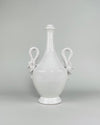 Vintage large Italian white ceramic vase from the mid 20th century, measuring 36 cm tall and 22 cm wide, with a glossy ivory glaze, rounded amphora body, long tapered neck, pedestal foot and two sculptural swan handles. The symmetrical form combines classical Mediterranean influence with decorative Renaissance Revival and neo Baroque details.