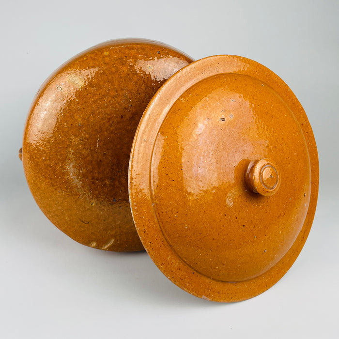 Dark brown glazed interior of the antique French terracotta marmite, showing concentric wheel marks, a deep cylindrical cooking chamber and two applied handles. Made in Vallauris for traditional wood fire cooking, this signed Foucard Jourdan vessel combines the forms of a confit pot, pottery crock and Provençal cooking pot with lid.
