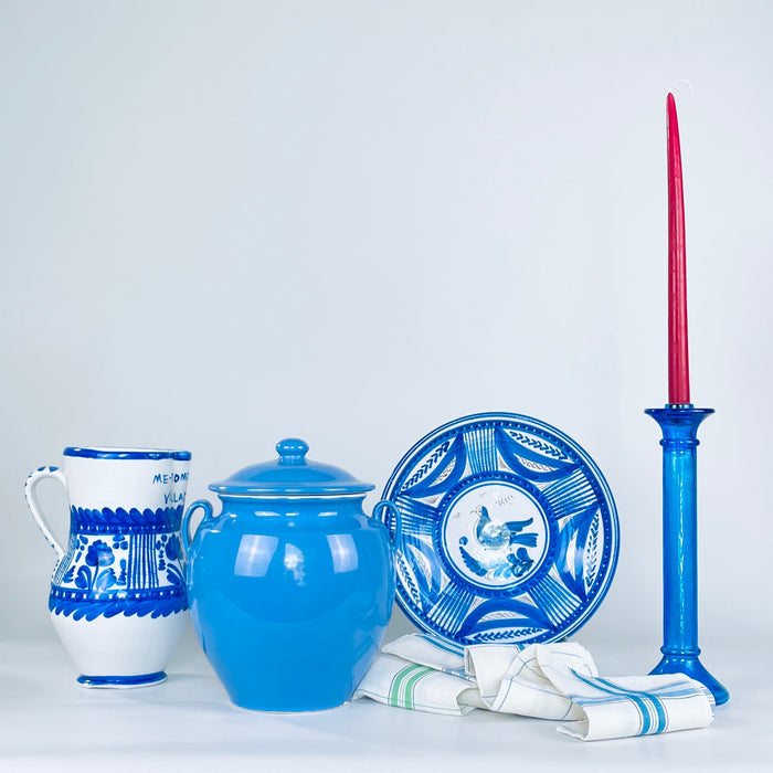 Early 20th century French confit pot with matching lid, lustrous blue glaze, rounded shoulders and a gently narrowing base. The loop handles sit high beneath the rolled rim, giving this Martres Tolosane pottery jar an elegant symmetry for use as lidded storage, a console accent or Mediterranean home decor.