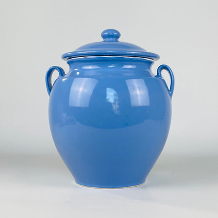 Antique French blue confit pot with its fitted domed lid, rounded finial, two loop handles and softly tapered faience body. Made in the Martres Tolosane pottery tradition during the early 20th century, this preserving jar is styled with blue and white ceramics as French country decor and vintage kitchen decor.