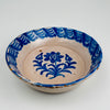 Front view of a 19th century Granada Fajalauza lebrillo, showing hand-painted cobalt blue floral decoration and rhythmic border brushwork on Spanish tin-glazed ceramic. The glaze shows soft cobalt diffusion valued in antique pottery. Suitable as wall hanging ceramic, decorative serving bowl, or table centerpiece for French Country Decor, Cottage Decor, and Farmhouse Decor styling.