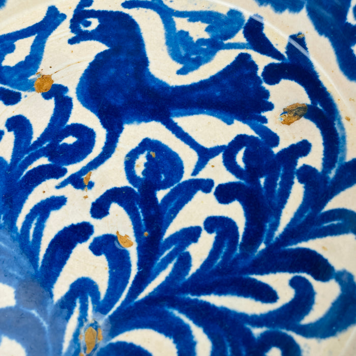 Detail of the pierced rim holes on an antique ceramic wall bowl, confirming intentional wall display in traditional Andalusian homes. Today, this feature allows easy styling as wall hanging ceramic decor, while the bowl itself remains suitable as a rustic table centerpiece.