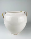 White glazed earthenware confit pot from Martres Tolosane, France, dating to the early 20th century. The wheel thrown body retains subtle horizontal making lines, scattered surface marks, small glaze losses and a fine diagonal surface hairline, authentic age details that complement restrained wabi sabi decor.
