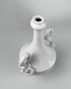 Vintage Italian white pottery vase showing both high looping swan handles balanced against the tall narrow neck and rounded amphora body. The ivory glazed earthenware surface has gentle tonal variation and firing specks, while the classical proportions suit mid century modern decor when used as a sculptural statement rather than a strictly modernist vessel.
