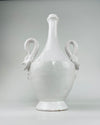  vintage Italian white ceramic vase, with both swan handles visible around the rounded shoulder. Minor rim nicks and exposed warm clay appear at the mouth, while the deep interior channel supports display with dried stems or a potential lamp base conversion.
