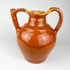 Large antique French gargoulette water jug from Southwest France, dating to the early 20th century and wheel thrown in glazed terracotta. Its rounded body, broad filling mouth, high loop handle and hollow tubular spout identify a traditional water carrier, while the honey brown and yellow glaze adds strong sculptural character for French country decor.