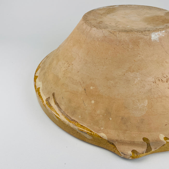 Oversized glazed terracotta French tian bowl held in hands for scale, showcasing its 39cm width and deep utilitarian profile. Excellent statement piece for contemporary rustic, Japandi-inspired, or French country homes where organic materials and historic craftsmanship anchor warm, textural interior design.