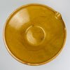 Large provincial French tian bowl with time-worn glaze and handcrafted rim, demonstrating traditional ceramic craft used historically for food preparation. A strong accent piece for contemporary rustic interiors, wabi-sabi styling, and slow-living inspired kitchen decor, offering earthy colour and sculptural depth.