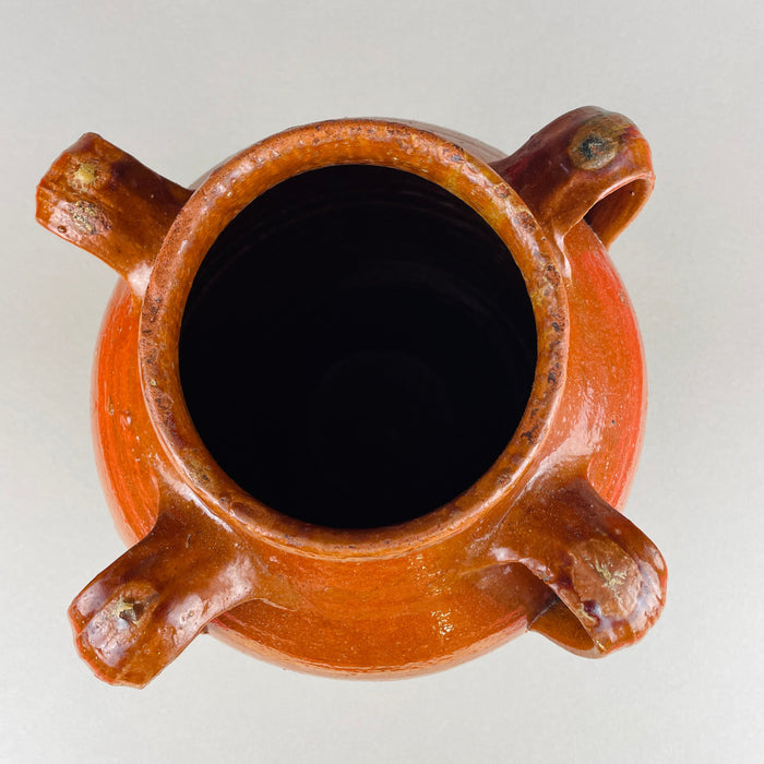 Close-up of the handle and upper shoulder of the Spanish terracotta vase, revealing hand-formed ridges and light glaze wear from age. These marks enhance its authentic character, perfect for interior designers seeking vintage Mediterranean ceramics