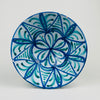 Spanish Granada Fajalauza lebrillo bowl in blue and green on a white tin glaze ground, made in glazed terracotta and sized f     or tabletop use. The deep bowl form supports tapas serving, fruit, or bread, and the pierced hanging holes allow wall hanging ceramic display; condition includes rim glaze losses and edge nicks.