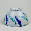Decorative bowl underside suitable for tapas serving, fruit display, or a table centerpiece, and also works as wall hanging ceramic decor because of pierced hanging holes.