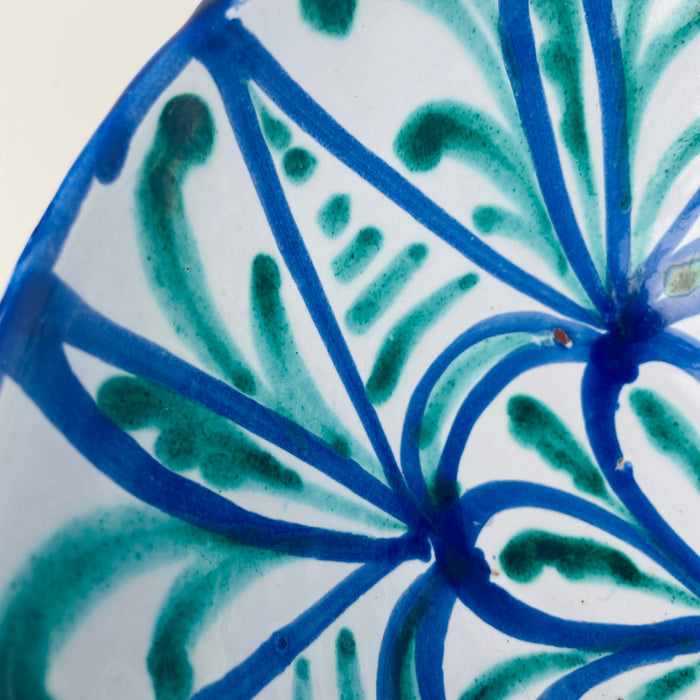 Granada Fajalauza lebrillo bowl in tin glazed terracotta, hand painted in cobalt blue and copper green with a radial rosette and vegetal geometry. 