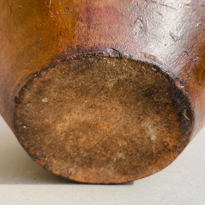 Close-up of gargolette's base showing age-rich patina, hand-thrown terracotta surface, and signs of historical use.