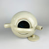 Antique French white pottery gargoulette from Provence, circa 1940s, crafted in stoneware with ovoid body, overhead handle, side spout, and matching lid. The glossy glaze and large 32 cm size make it a statement piece for  farmhouse decor and country french decor
