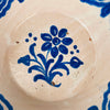 19th century Granada Fajalauza lebrillo showing the full floral composition and scalloped border pattern in cobalt blue. The tin glaze shows subtle pooling and soft cobalt diffusion from firing. Use as wall hanging ceramic, table centerpiece, or serving bowl for French Country Decor and Cottage Decor interiors