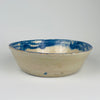 Antique Spanish Granada style Fajalauza bowl, tin glazed terracotta with cobalt blue painted floral sprig and wide rim band. Deep serving bowl shape for tapas, olives, and citrus, and decorative use on open shelving. The blue and white palette supports Mediterranean decor, wabi sabi decor, and coastal decor styling without overpowering a neutral space.