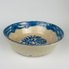 Spanish lebrillo bowl in blue and white tin glazed terracotta with cobalt floral decoration and a strong rim border band. Diameter 24.7 cm and height 7.7 cm. Practical for tapas serving and fruit presentation, while also functioning as a decorative ceramic object for farmhouse decor kitchens, Mediterranean decor dining, and Spanish pottery wall arrangements.