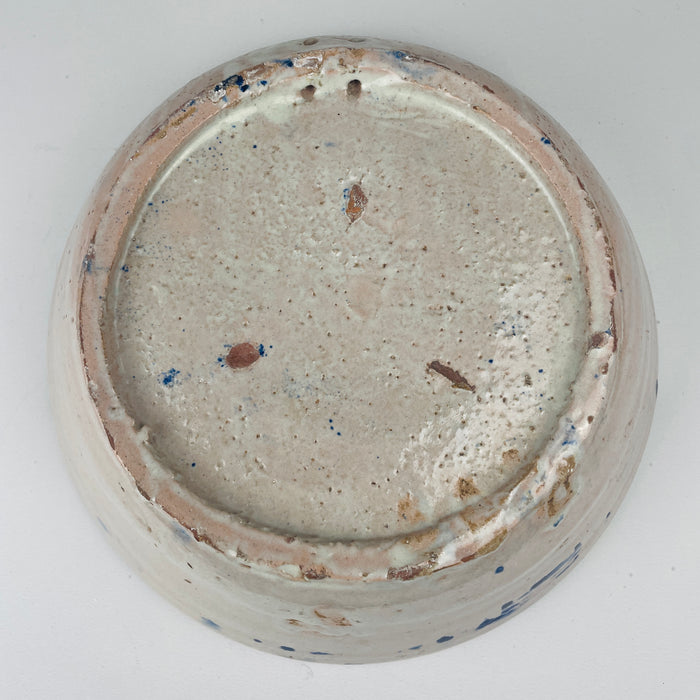 Underside of hand painted Fajalauza ceramic bowl, 19th century Granada tin glaze, used historically as a kitchen and household vessel featuring holes for wall hanging 