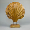 wood shell sculpture by ROC Objects, showing the hand-carved fluted ridges and organic silhouette in solid acacia wood. Ideal for Japandi, Wabi-Sabi, or modern rustic interiors where natural sculpture adds texture and warmth to a shelf or console.