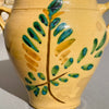 Hand-painted Tree of Life olive branch motif on antique Spanish orza from Lucena, reflecting Andalusia’s agrarian heritage.