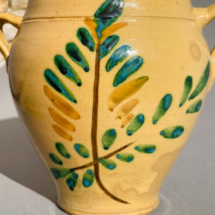 Hand-painted Tree of Life olive branch motif on antique Spanish orza from Lucena, reflecting Andalusia’s agrarian heritage.