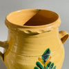 Top view of antique Andalusian orza, showcasing decorative scalloped rim and traditional majolica glazing techniques.