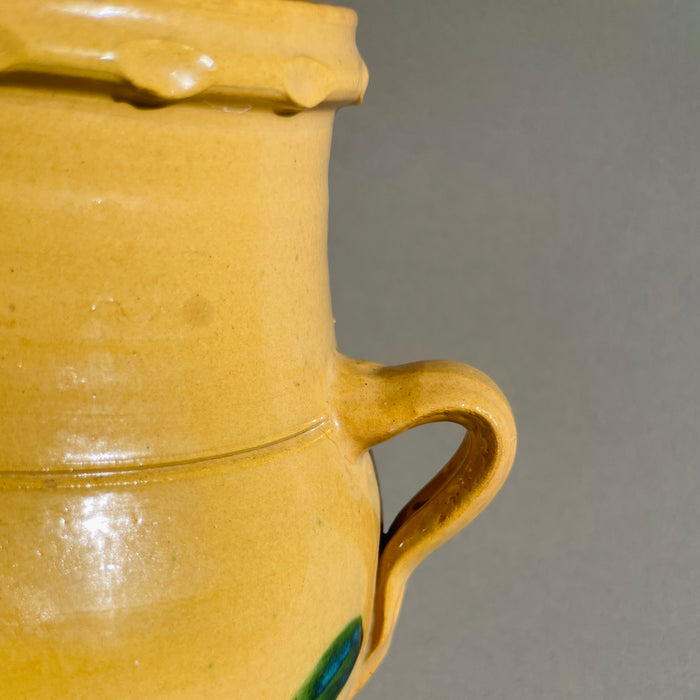 Close-up of double handles on antique Andalusian orza, highlighting traditional early 20th-century Spanish pottery craftsmanship.