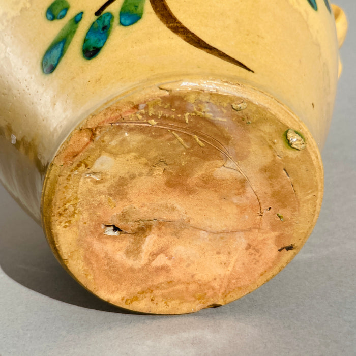 Base detail of antique Spanish majolica "orza" showing unmarked terracotta bottom with natural wear, crafted in Lucena, Córdoba.