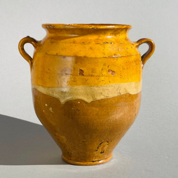 vintage French terracotta confit pot with traditional ochre glaze, rustic character, and natural surface wear, ideal for farmhouse or Mediterranean style interiors.