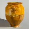 Rustic antique French kitchen jar made of glazed terracotta, used for preserving food, featuring traditional two-handle design and historical patina.