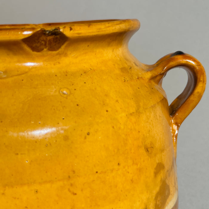 Antique French terracotta pottery jar with twin handles and ochre glazed finish, perfect for country kitchen and rustic interiors.