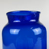 Hand blown cobalt vases photographed under natural light, revealing the blue tone’s transparency and mineral depth. Their tall profiles suit large consoles, shelf styling, or table centerpieces. The pair works well within organic modern decor, rustic home decor, and Mediterranean decor homes.