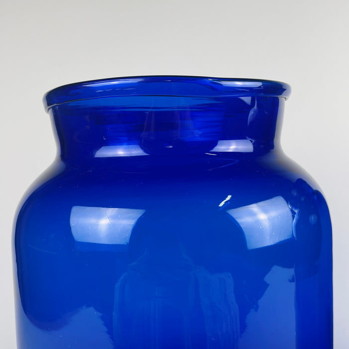Hand blown cobalt vases photographed under natural light, revealing the blue tone’s transparency and mineral depth. Their tall profiles suit large consoles, shelf styling, or table centerpieces. The pair works well within organic modern decor, rustic home decor, and Mediterranean decor homes.