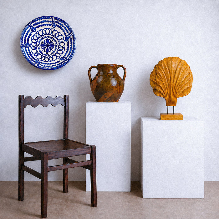 Hand painted interior decoration on a large Los Arrayanes Fajalauza bowl from Granada, Spain, with layered cobalt blue brushwork over cream glazed earthenware. Interlocking circular bands, scalloped lines and stylized vegetal forms reveal the spontaneous artisan technique that gives this Spanish lebrillo bowl its individual character and strong decorative impact.