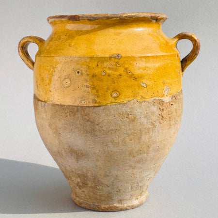 Front view of a vintage French farmhouse terracotta jar, showcasing its warm patina.