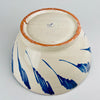 Blue and white Spanish Fajalauza bowl by Cerámica Los Arrayanes, with an open flared profile and a richly decorated interior of floral, looping and scalloped motifs. The cobalt brushwork continues across the outer wall in broad gestural marks, creating a large handmade Granada pottery centerpiece suited to serving, tabletop display or wall decor.