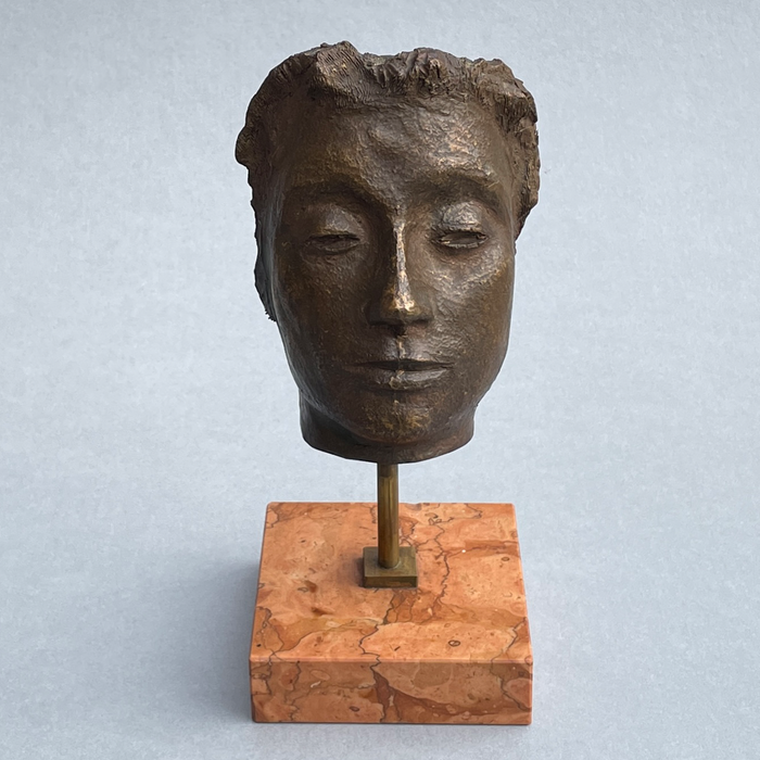 Signed Italian modernist sculpture titled Maschera, featuring closed eyes and refined bronze facial detail on a solid marble base.