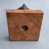 Detail of the red marble veining beneath the sculpture, creating a strong base for the piece.