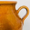 Hand-thrown rustic terracotta confit pot with twin handles, ideal as a decorative planter or kitchen storage vessel.